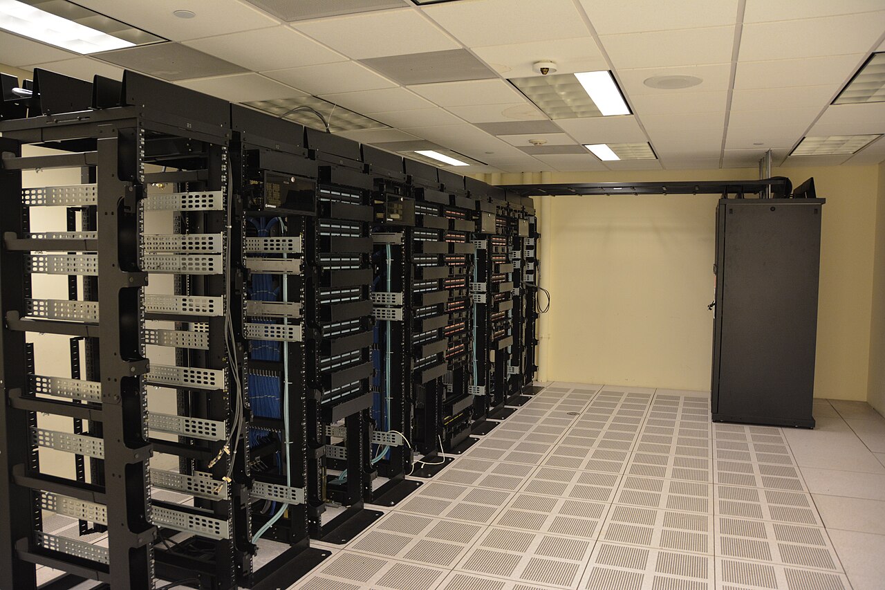 Rows of server racks with cabling in a data center