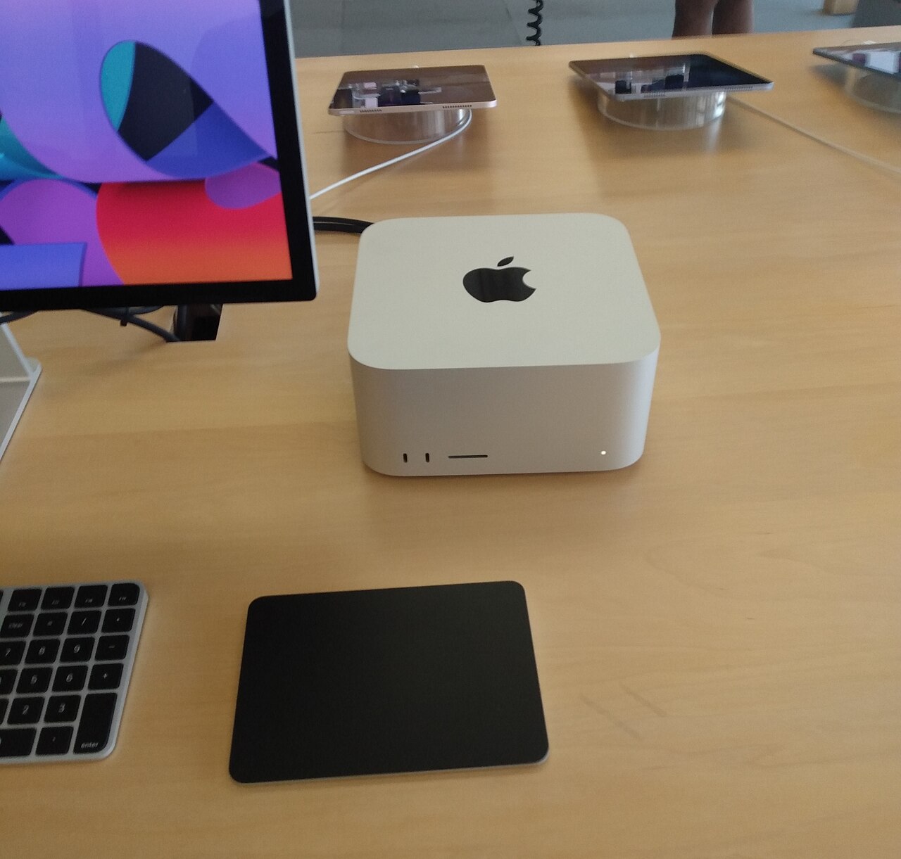A Mac Studio desktop computer displayed in an Apple Store