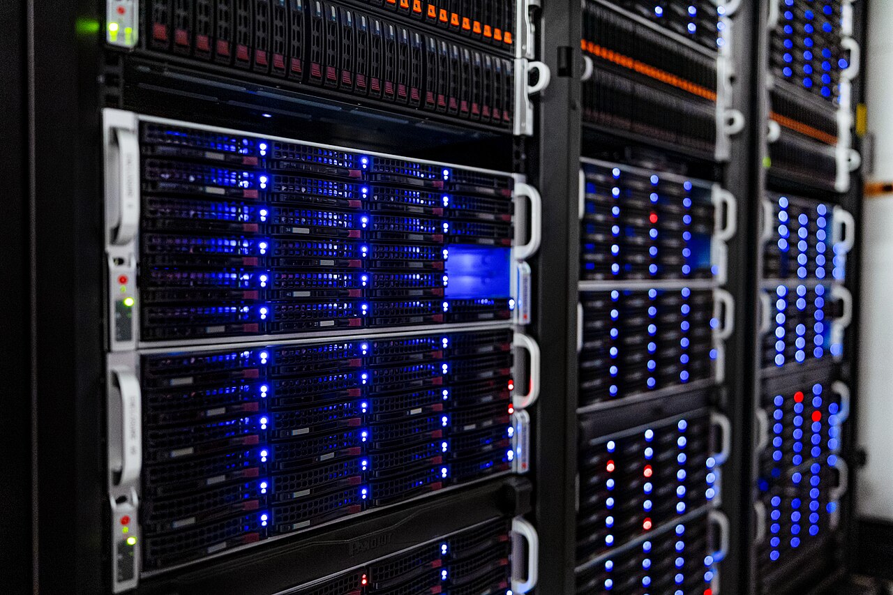 Rows of server racks in a data center computer room
