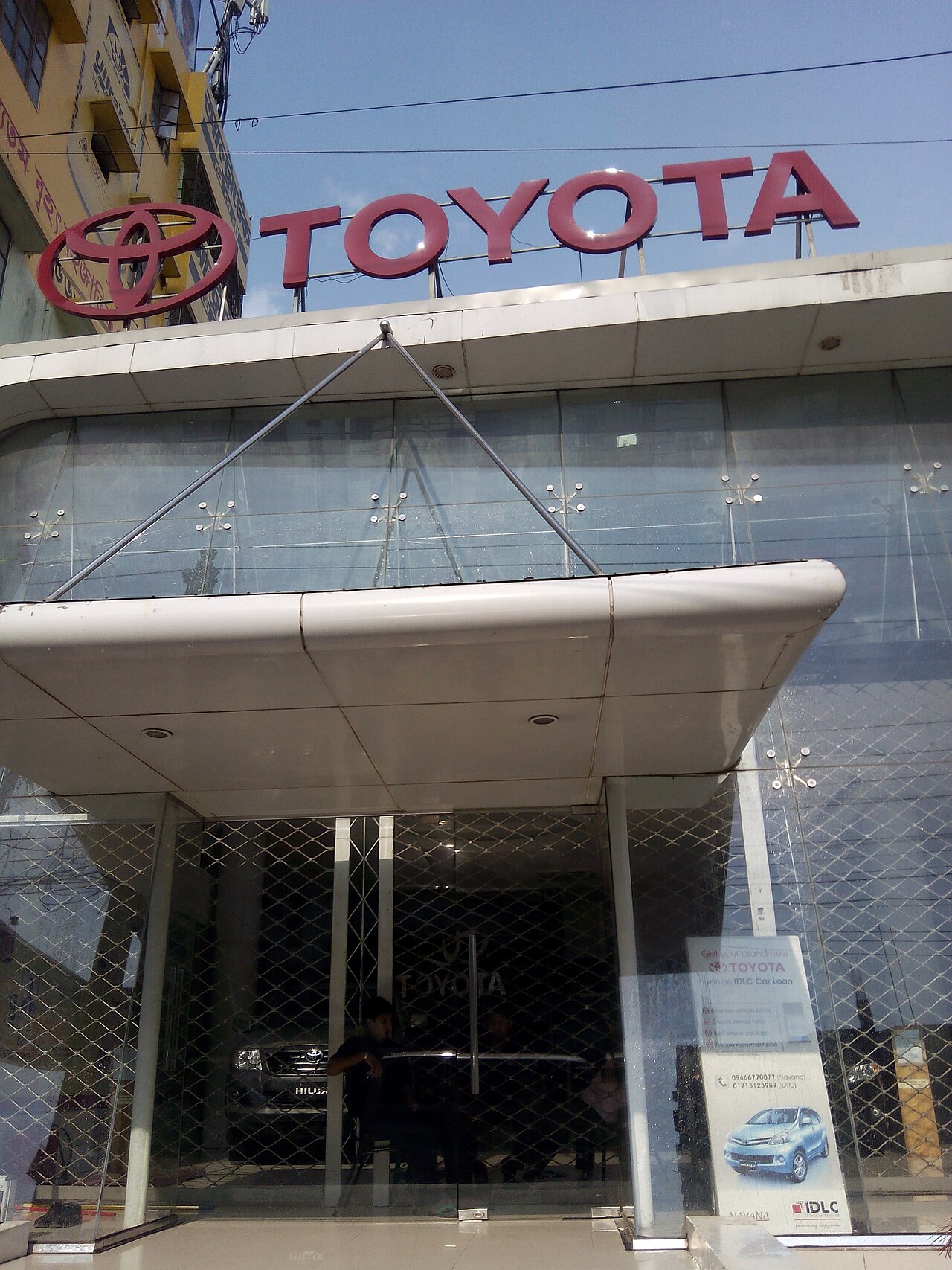 Showroom of a Toyota dealership with several vehicles on display