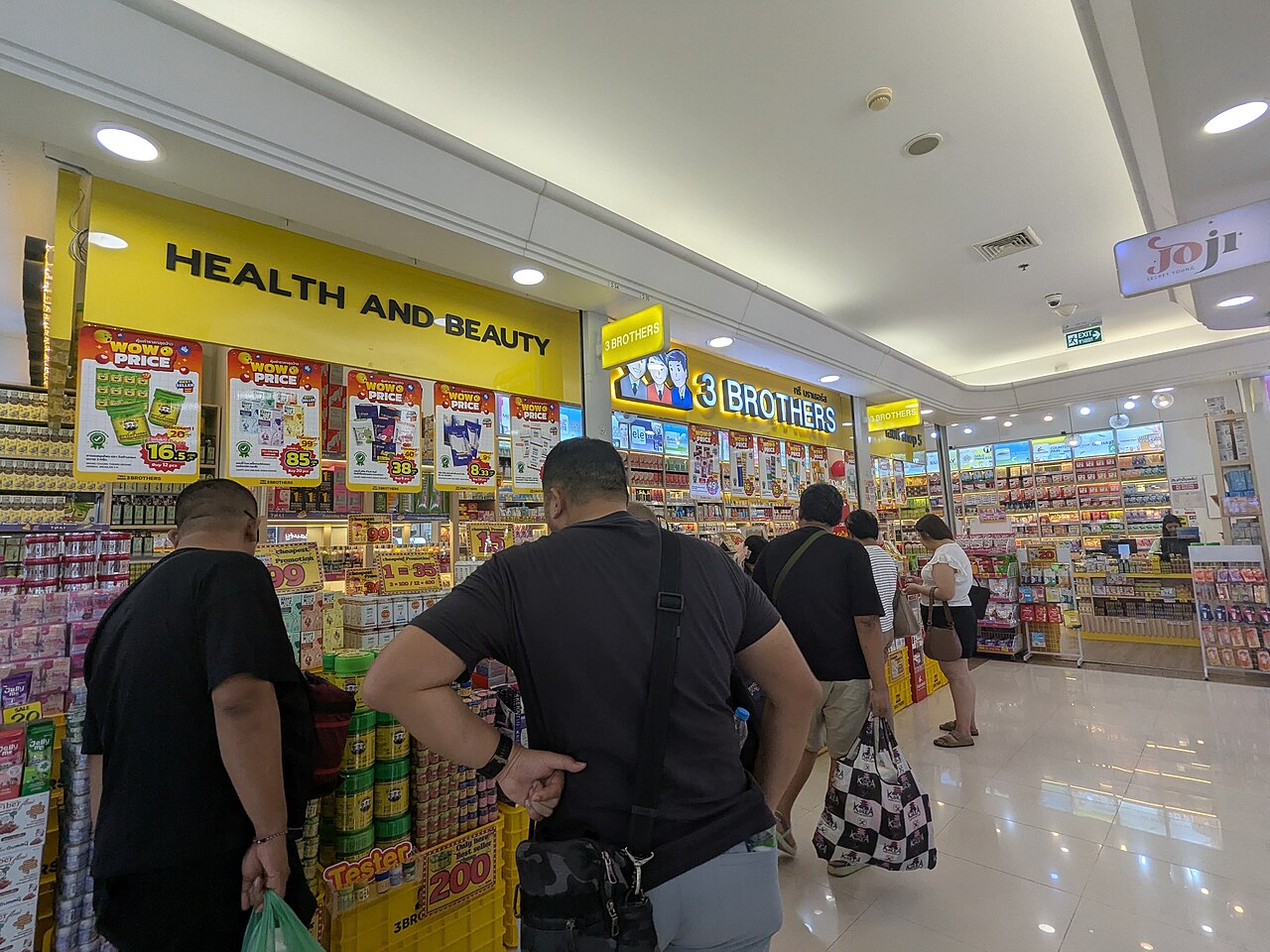 Customers browsing the shelves in a physical store