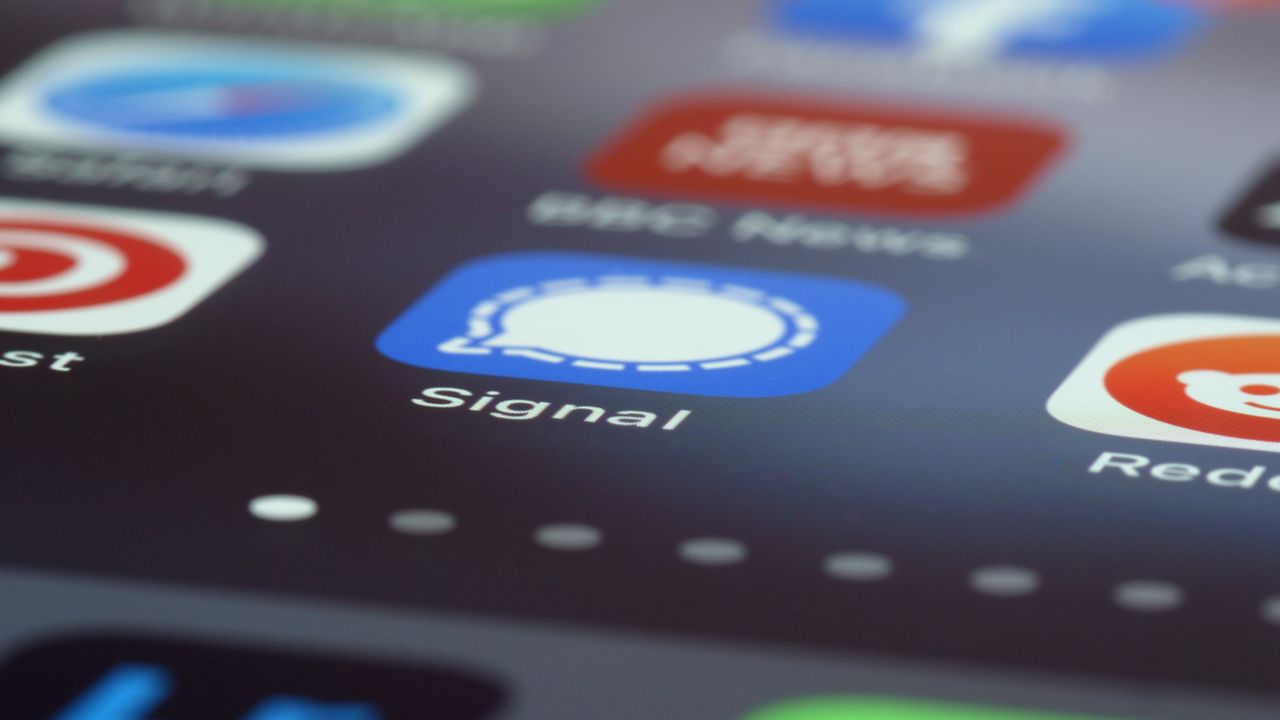Close-up of a smartphone screen showing messaging app icons